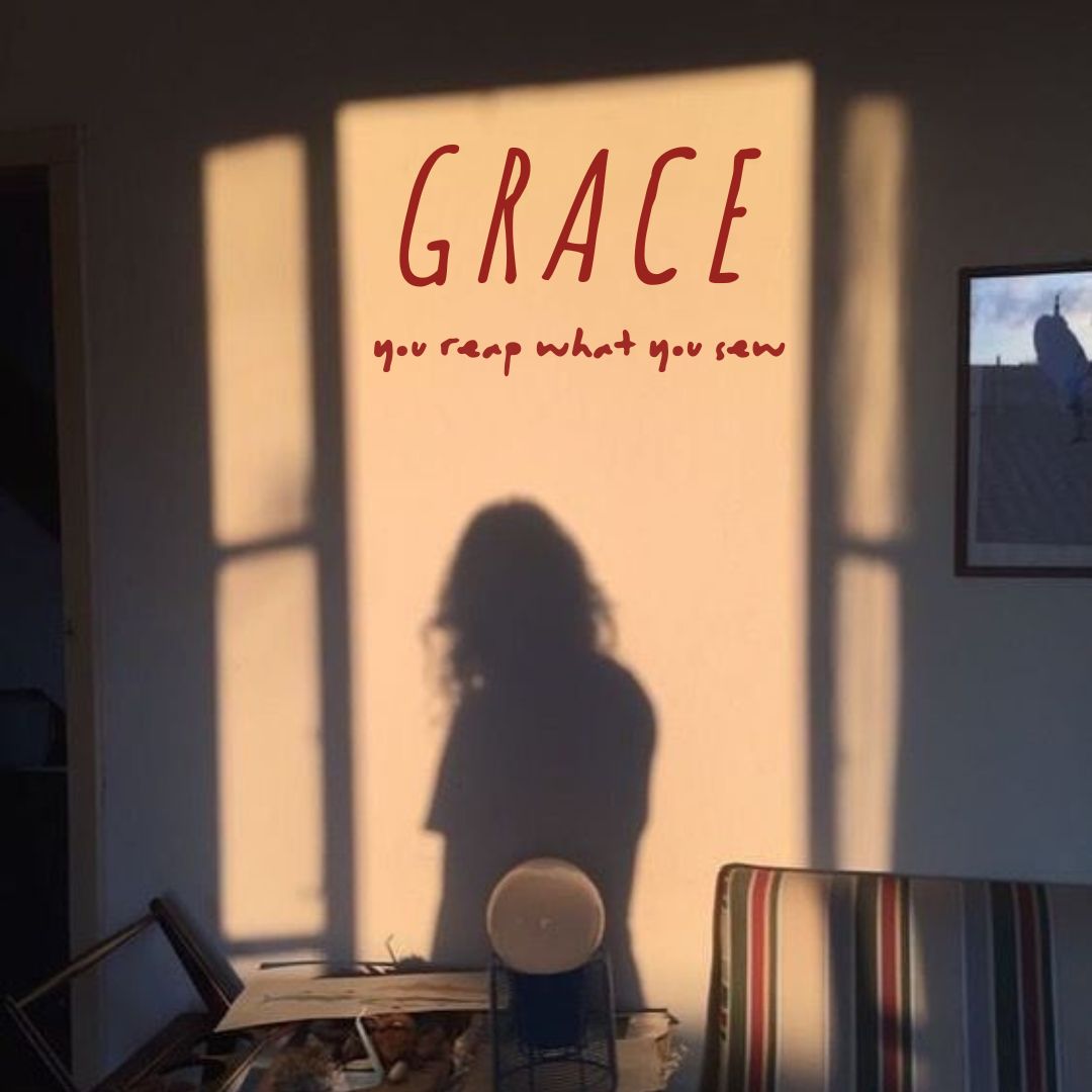 Poster for Grace: a shadow of a person with long hair against a light coloured wall with a striped sofa and vintage side table against it.
